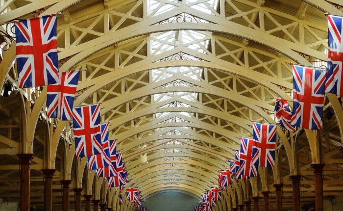 Union Jack flags hanging from an arched ceiling