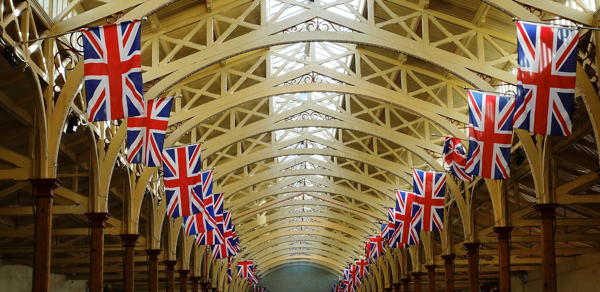 Union Jack flags hanging from an arched ceiling